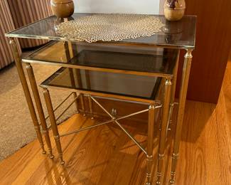Stacking brass and glass tables