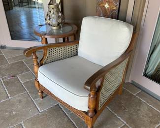 Brown Jordan woven arm chair with matching ottoman and end table 