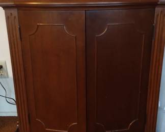 sideboard with granite top.  Doors are magnetized to stay closed.