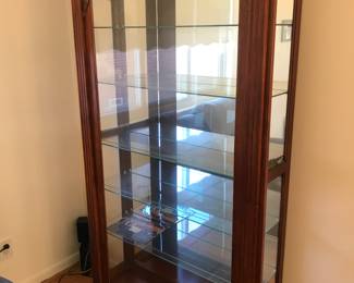 Door slides open to the left for this beautiful solid wood display cabinet!