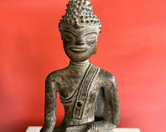 A collection of 18th century bronze and wood Thai Buddha figures