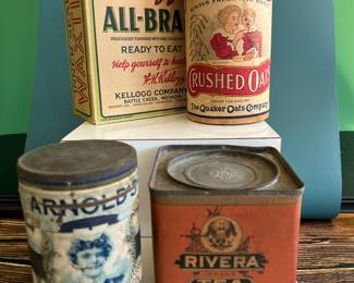 Antique advertising tins and cardboard containers: G&P bread, McLaughlin Coffee, Quaker, CR Tartar, Wag Coffee, Schepp’s Cocoanut, A&P Coffee, Eslinger honey, Louvain Coffee, Gold Bond A1 Coffee, Thomas J Webb Coffee, CW Coffee, SE Johnson powdered dancing wax, Tropic Aroma Coffee, Maxwell House Coffee, Forbes Quality Coffee, Great American pepper, Rich’s Canton Ginger, Ferndall Coffee, Bravo Coffee, Mrs. Stewart’s liquid bluing, Ideal Not-A-Seed Raisins, Cracker Jack, Calumet Baking Powder, Golden Rule Cocoa, Watkins Baking Powder, Back Diamond Cod, Bermont Whiskey, Brach’s Supreme Marshmallows, Planters Pennant Peanuts, Bunny Rolled Oats, A&P cloves spice tins, Heinz, Ivin’s biscuits, Crispo Graham Dainties, Hills Bros, A. Weinfeld sweet pickles, Kellogg’s All Bran, and more!