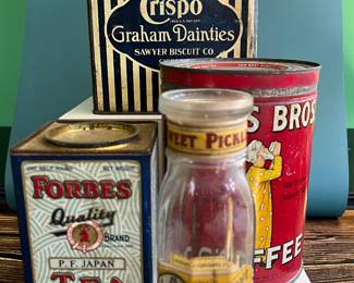 Antique advertising tins and cardboard containers: G&P bread, McLaughlin Coffee, Quaker, CR Tartar, Wag Coffee, Schepp’s Cocoanut, A&P Coffee, Eslinger honey, Louvain Coffee, Gold Bond A1 Coffee, Thomas J Webb Coffee, CW Coffee, SE Johnson powdered dancing wax, Tropic Aroma Coffee, Maxwell House Coffee, Forbes Quality Coffee, Great American pepper, Rich’s Canton Ginger, Ferndall Coffee, Bravo Coffee, Mrs. Stewart’s liquid bluing, Ideal Not-A-Seed Raisins, Cracker Jack, Calumet Baking Powder, Golden Rule Cocoa, Watkins Baking Powder, Back Diamond Cod, Bermont Whiskey, Brach’s Supreme Marshmallows, Planters Pennant Peanuts, Bunny Rolled Oats, A&P cloves spice tins, Heinz, Ivin’s biscuits, Crispo Graham Dainties, Hills Bros, A. Weinfeld sweet pickles, Kellogg’s All Bran, and more!