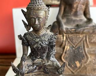 A collection of 18th century bronze and wood Thai Buddha figures