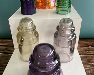 Antique glass electric insulators: lots of colors: carnival glass, marigold, milk glass, black, blue, cobalt, turquoise, amber, green, emerald, amethyst