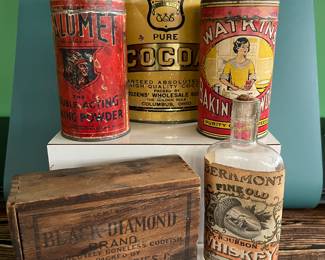 Antique advertising tins and cardboard containers: G&P bread, McLaughlin Coffee, Quaker, CR Tartar, Wag Coffee, Schepp’s Cocoanut, A&P Coffee, Eslinger honey, Louvain Coffee, Gold Bond A1 Coffee, Thomas J Webb Coffee, CW Coffee, SE Johnson powdered dancing wax, Tropic Aroma Coffee, Maxwell House Coffee, Forbes Quality Coffee, Great American pepper, Rich’s Canton Ginger, Ferndall Coffee, Bravo Coffee, Mrs. Stewart’s liquid bluing, Ideal Not-A-Seed Raisins, Cracker Jack, Calumet Baking Powder, Golden Rule Cocoa, Watkins Baking Powder, Back Diamond Cod, Bermont Whiskey, Brach’s Supreme Marshmallows, Planters Pennant Peanuts, Bunny Rolled Oats, A&P cloves spice tins, Heinz, Ivin’s biscuits, Crisp