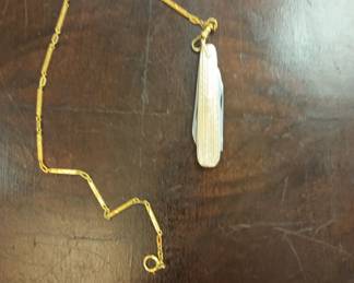 Ten karat gold pocket knife and ten karat gold watch Bob