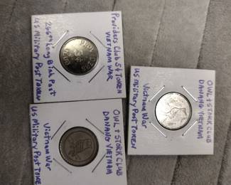 Vietnam War owl and stork Club tokens.