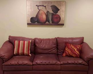 Leathercraft Sofa with Throw Pillows and Art