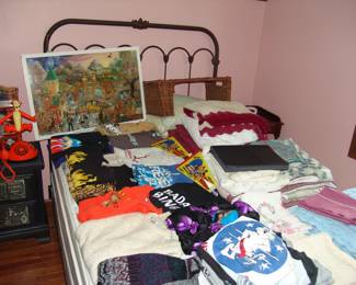 Metal bed with Disney and Concert TEE shirts