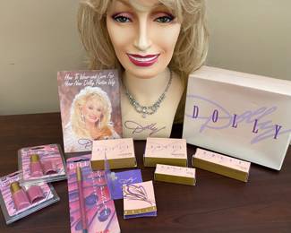 From the Dolly Cosmetic Line:
Dolly wig on mannequin head & rhinestone necklace, original box.
Lip color, mascara, pressed powder, Dolly cologne vials, eye pencil & wig care pamphlet.