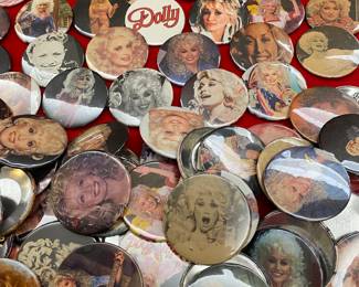 Many vintage Dolly lapel buttons