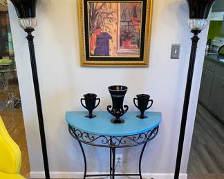 Pr. of black mid-century Hollywood Regency floor lamps, Demilune table, vintage  black vases, framed plant art.