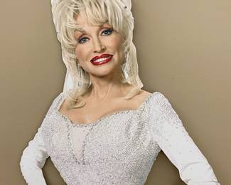 Half-body cardboard cutout of Dolly in white