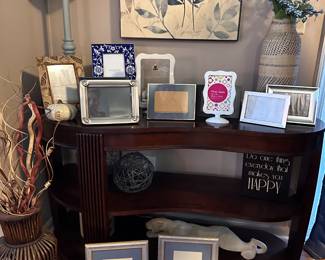 Entry table, picture frames, lamp and wall decor