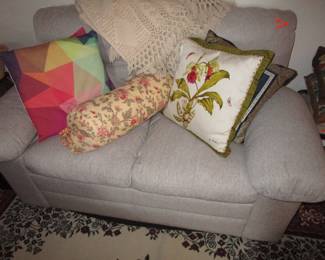 Cute newer loveseat with lots of pillows
