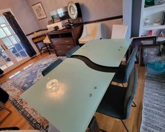 Expandable glass table with six chairs 450.00