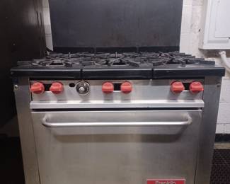 This is a very clean and well working commercial six burner stove with oven. It runs on natural gas. The dimensions are 34" wide x 30" deep x 51" high. 