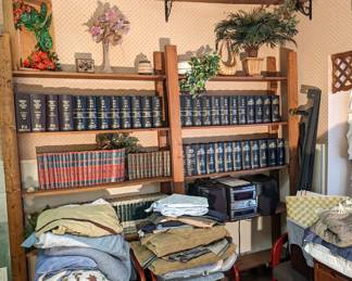 Book Cases. Chairs. Bedding. Books. Antiques. 