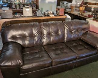 Like New Leather Couch with foldout Queen Bed that has never been used. 
