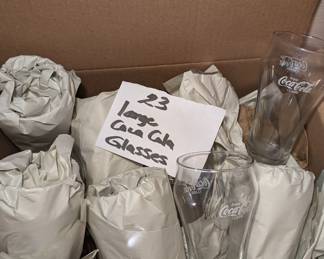 We have 23 Coke A Cola Glasses for sale. There is also sundae bowls and water glasses not pictured.