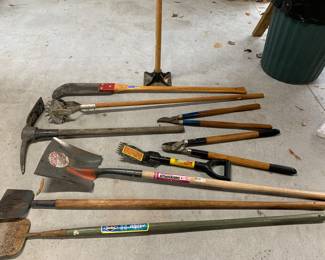 Plenty of Yard Tools, rakes, hoes, shovels, pruning tools, saws, hole diggers,  wedges, axes, pitch forks, pick, bush axe, wheel barrows, nesw replacement handles for some of the tools