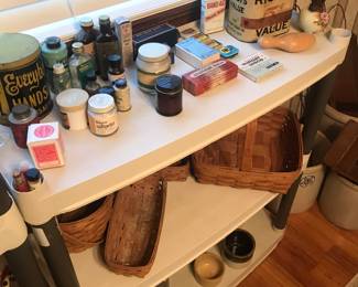 Even more old tins and bottles! Longaberger baskets too on the middle shelf