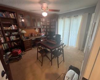 Office full of books, printers, games