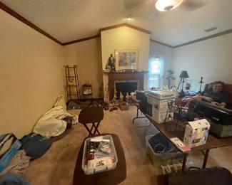 Two living rooms, couches, men, and women items