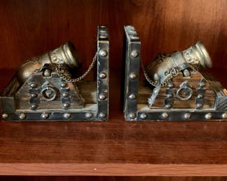 #95	wood/metal  canon book ends as is chip 	 $30.00 			
