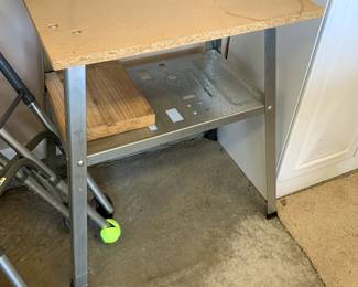#89	work table with metal base and wood top 24x20x31	 $25.00 			
