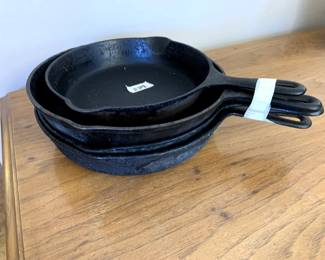 #128	set of 4 iron skillet no name 	 $35.00 			
