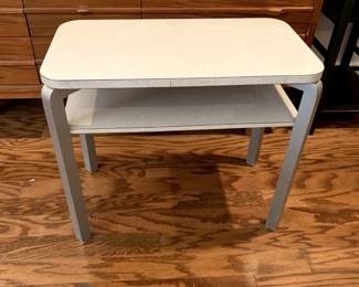 #17	mid century silver leg and 1 shelf table 24x14x21	 $45.00 			
