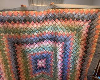 #111	factory made quilt pink blue green  82x 84	 $30.00 			
