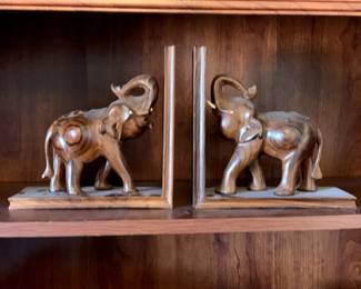 #94	wood carved elephant book ends as is tusk 	 $30.00 			
