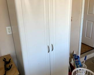 #67	white laminate cabinet with 4 shelves and 2 doors 30x17x71 as is front 	 $45.00 			
