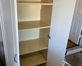 #67	white laminate cabinet with 4 shelves and 2 doors 30x17x71 as is front 	 $45.00 			
