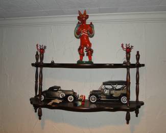 Devil statues, cars