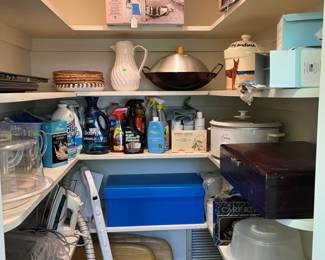 Closet filled with cleaning and kitchen items