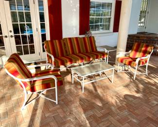 A couch, two matching chairs and coffee table. All this patio furniture is covered with Sunbrella quick dry material/foam.