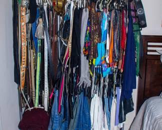 Assortment of women's clothes and belts