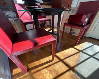 136. Glass Top Dining Table w/ Wood Base (42" x 30").      135. Pair of Red Leather Side Chairs
