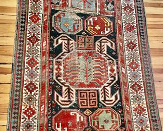 7. Antique Oriental Area Rug (3' 9" x 5'4")