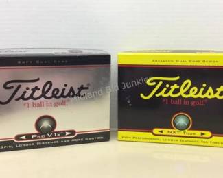 Several boxes of new golf balls