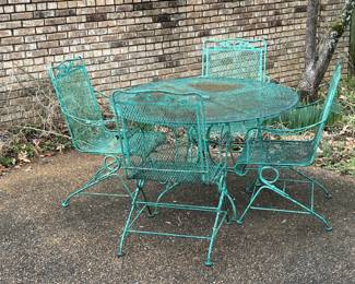 wrought iron patio table and 4 spring chairs.