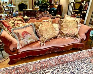 Antique sofa full of custom made pillows.