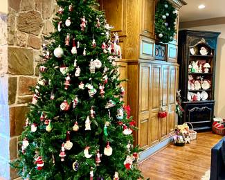 Large Christmas trees with 3 more in the garage in tree bags.