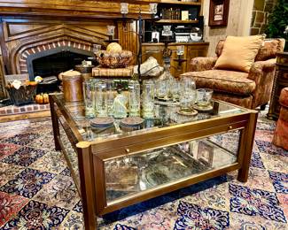 Notice the modern glass coffee table.  