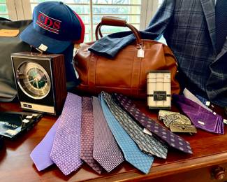 Coach leather duffel.  Hermes ties, Tiffany.