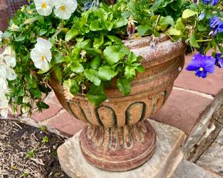 concrete urns and terracotta pots.